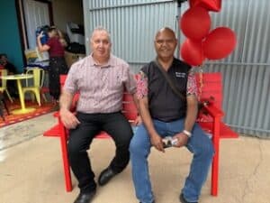 men sitting on a chair